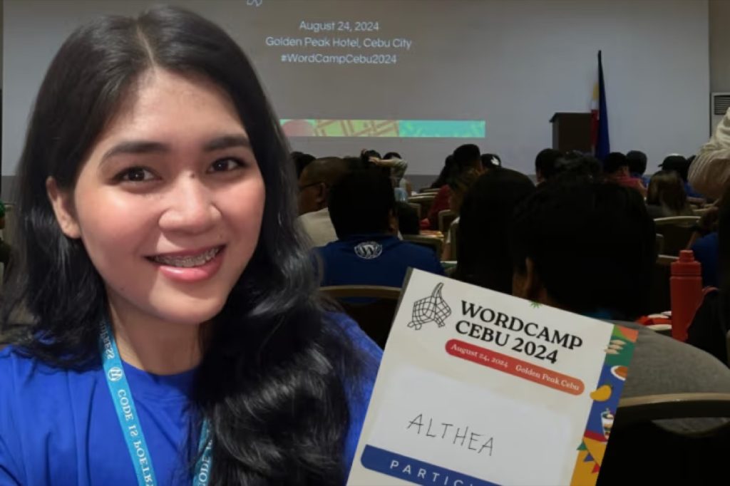 Althea Galan holding her WordCamp Cebu 2024 attendee badge